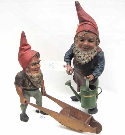 Appraisal: SET OF TWO GERMAN POTTERY GARDEN GNOMES one with watering