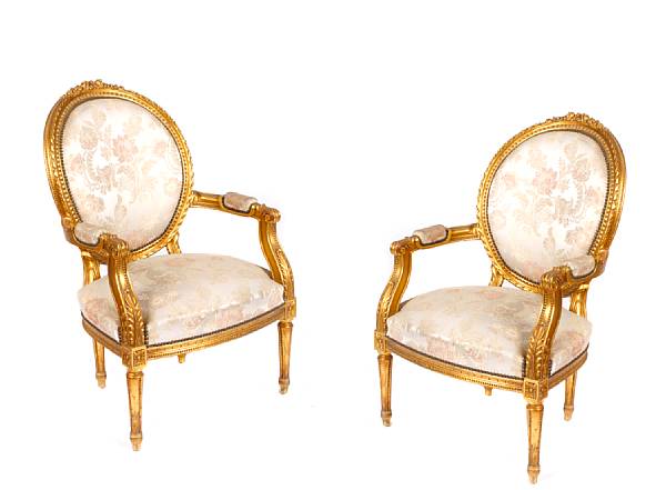 Appraisal: A pair of Louis XVI style gilt wood fauteuils height