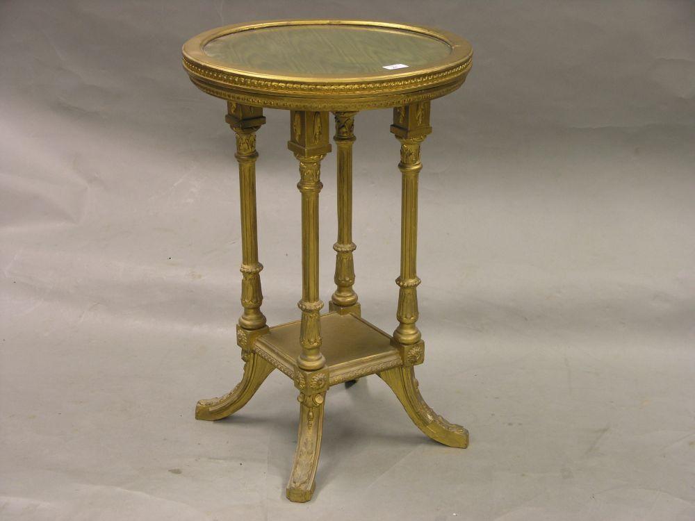 Appraisal: A th century circular gilt occasional table inset glass top