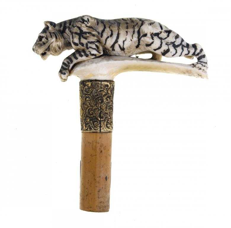 Appraisal: A CARVED IVORY CANE-HANDLE IN THE FORM OF A TIGER