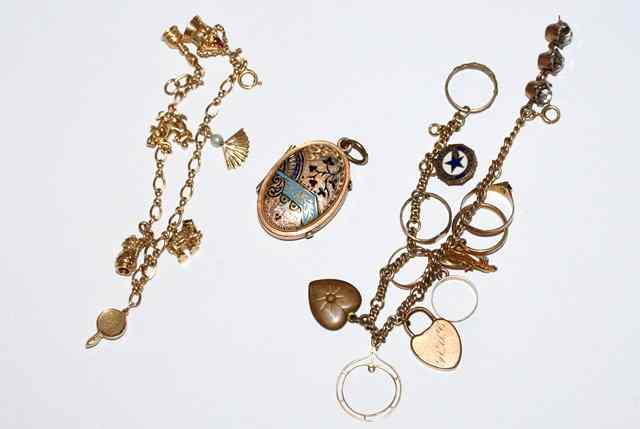 Appraisal: A CHARM BRACELET with seven ct gold charms attached a