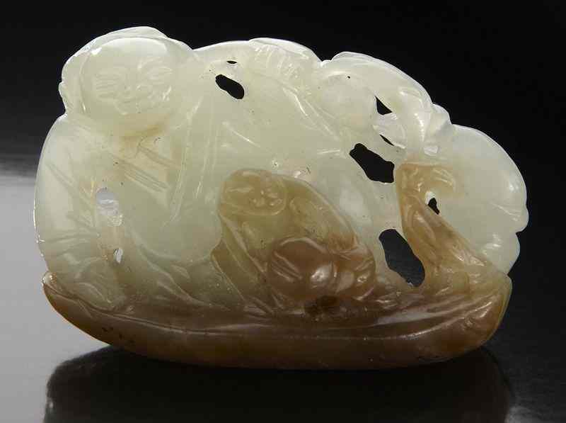 Appraisal: Chinese Qing carved jade pendantdepicting a boy and a monkey