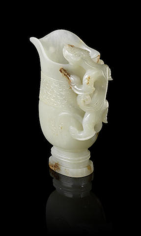 Appraisal: A pale green jade rhyton cup th th centuryThe very