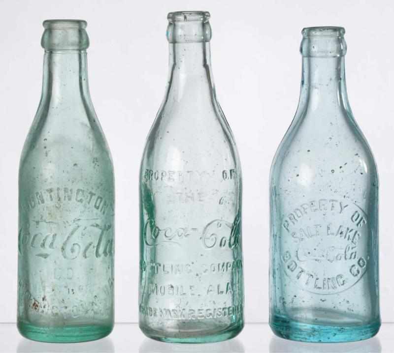 Appraisal: Lot of Coca-Cola Straight Sided Bottles Description Includes Mobile Alabama