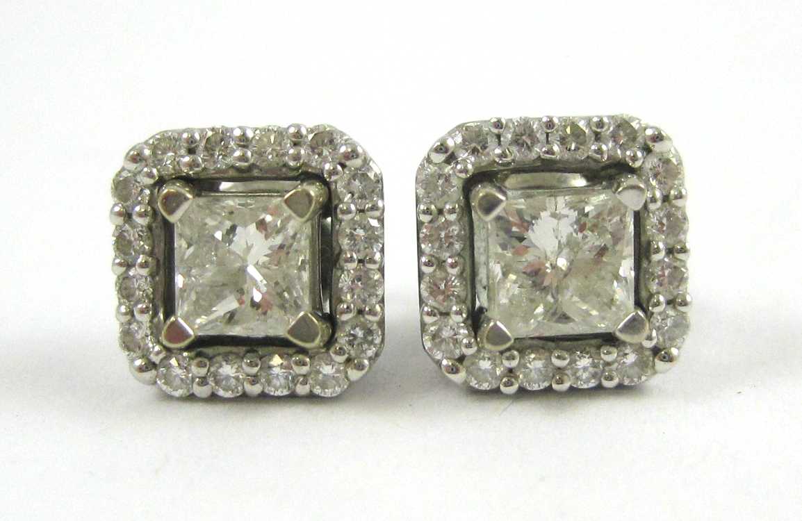 Appraisal: PAIR OF DIAMOND EAR STUDS WITH EARRING JACKETS Each k