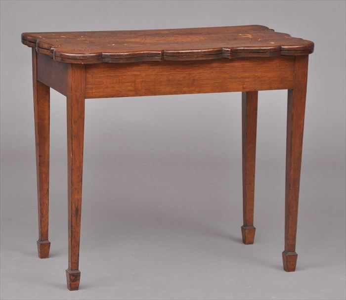 Appraisal: CONTINENTAL OAK AND MARQUETRY GAMES TABLE The shaped top decorated