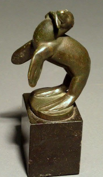 Appraisal: Bronze seal with fish on a black granite plinth c