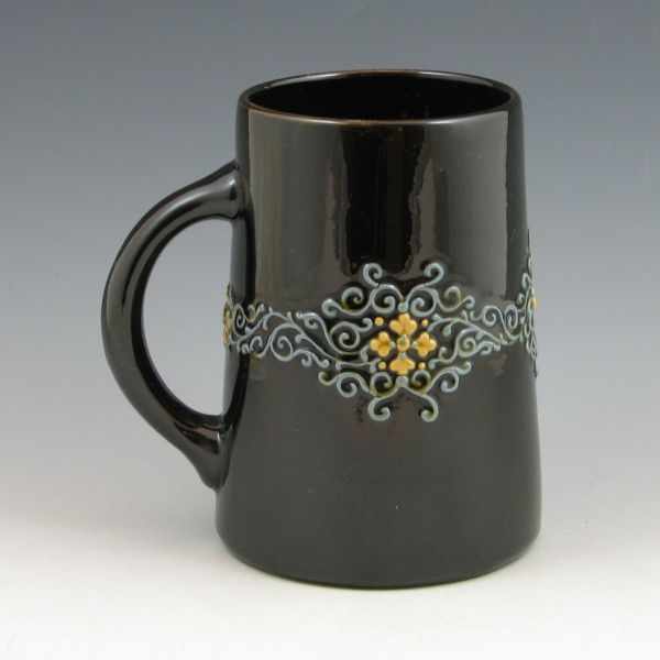 Appraisal: Weller Turada mug with squeezebag decoration on a brown or