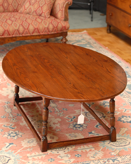 Appraisal: Oval Oak Coffee Table turned legs stretcher supports high wide