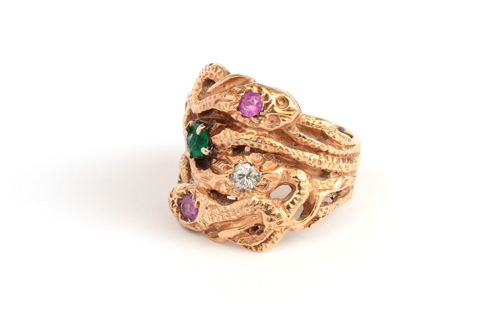 Appraisal: K SNAKE RING K snake ring contains one round brilliant