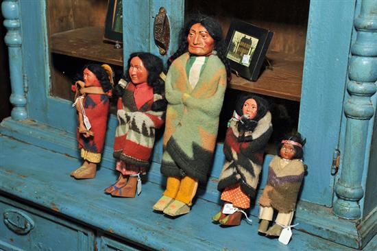 Appraisal: FIVE SKOOKUM INDIAN DOLLS Including three females two carrying children