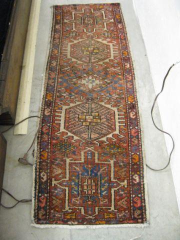 Appraisal: Heriz Persian Handmade Rug geometric designs red field ' x