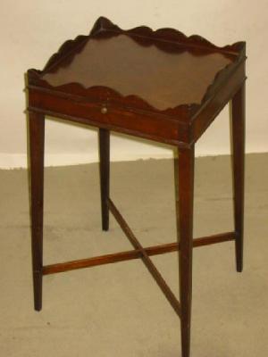 Appraisal: AN EDWARDIAN MAHOGANY URN STAND of oblong form with waved