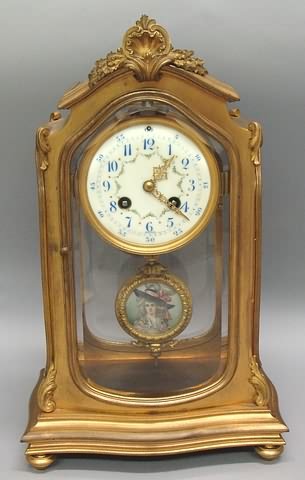 Appraisal: Bronze case day with floral painted porcelain dial beveled glass