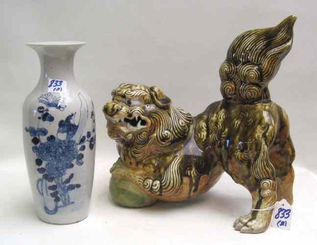 Appraisal: TWO CHINESE COLLECTIBLES a pottery foo dog with front paws