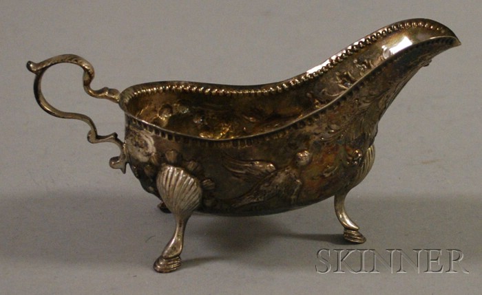 Appraisal: Silver Sauce Boat chased and embossed with rocaille and birds