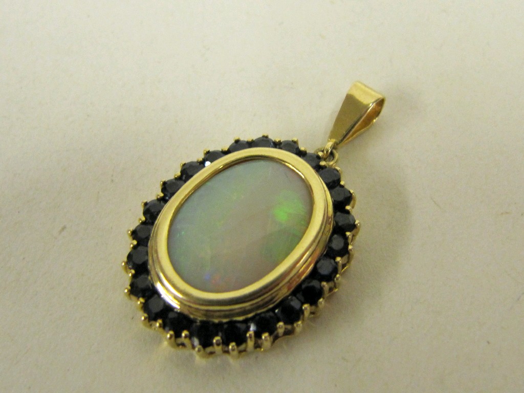 Appraisal: Eighteen carat gold opal and sapphire set pendant