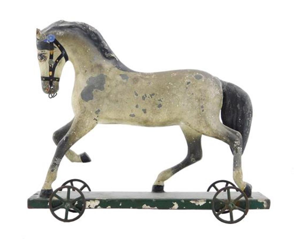 Appraisal: Early tin horse pull toy American th C prancing horse