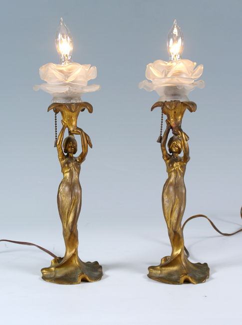 Appraisal: PAIR ART NOUVEAU FIGURAL LAMPS Gilt cast metal maidens holding