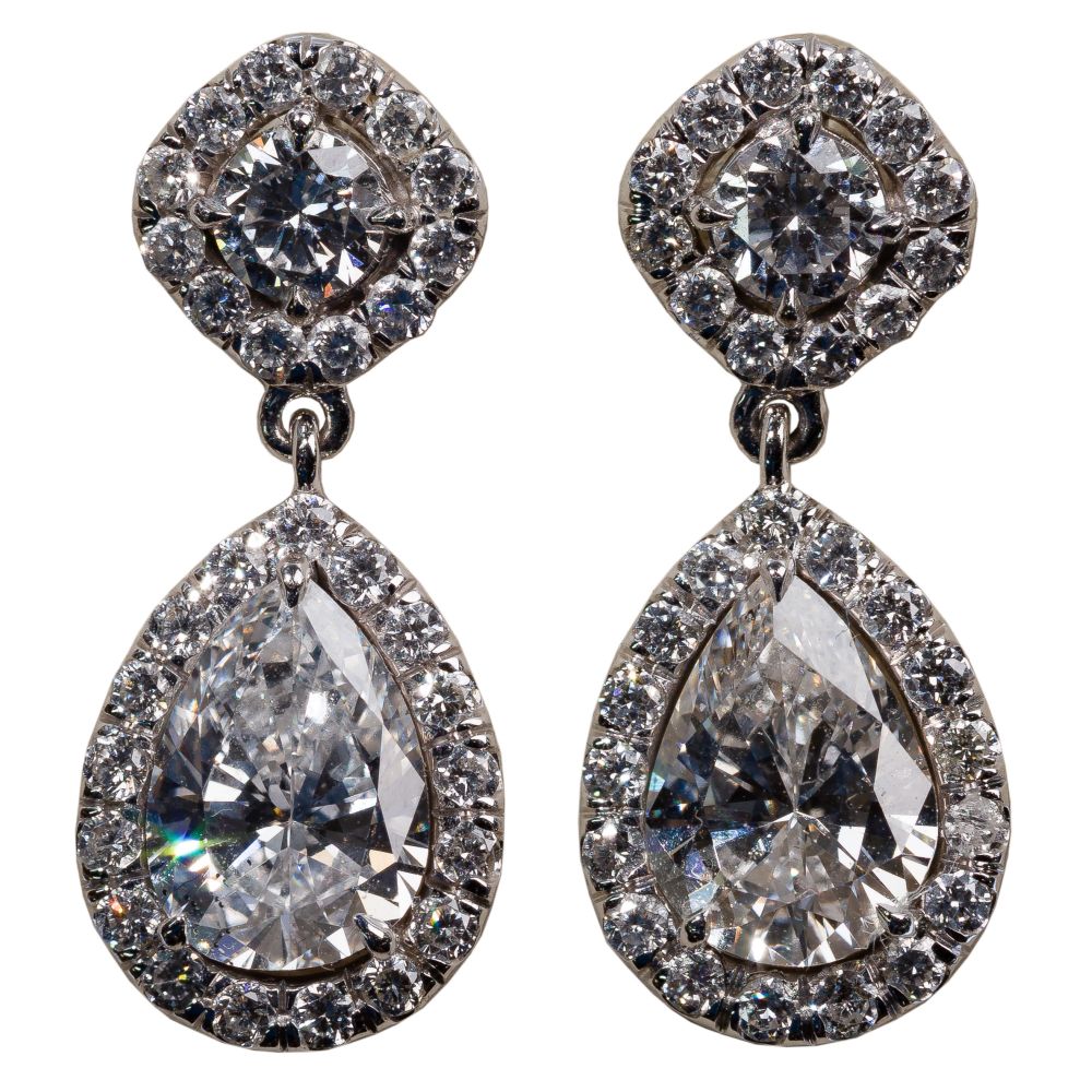 Appraisal: K WHITE GOLD AND DIAMOND PIERCED DANGLE EARRINGSEach having a