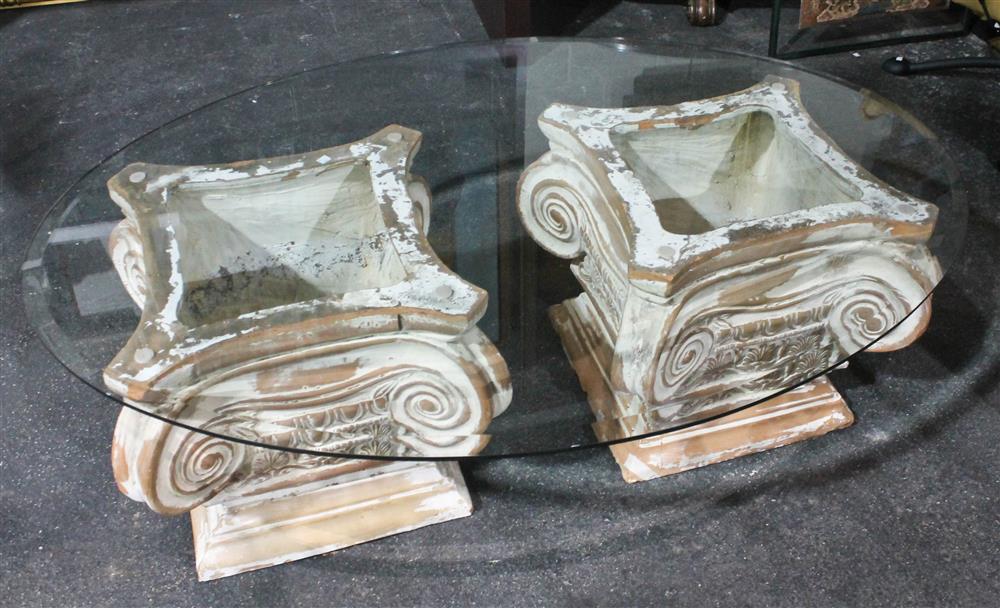 Appraisal: BEVELED OVAL GLASS TOPPED COMPOSITE IONIC CAPITALS COFFEE TABLE glass