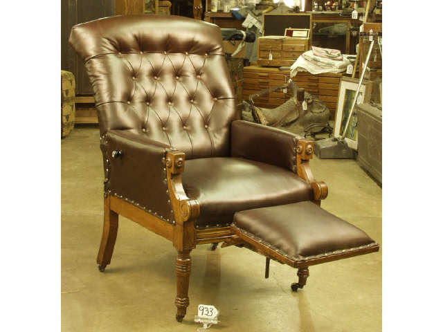 Appraisal: 's Eastlake style walnut chair with retractable footstool and reclining