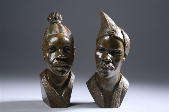 Appraisal: TWO ZIMBABWEAN CARVED BUSTS OF SHONA MAN AND WOMAN By