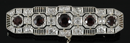 Appraisal: An Art Deco style garnet and diamond brooch The rectangular