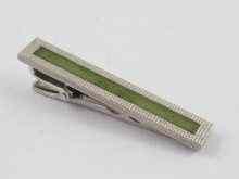 Appraisal: A white metal tests ct gold and jade tie clip