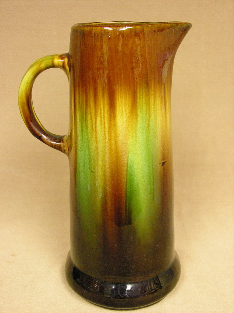 Appraisal: TALL POTTERY JUG PITCHER Possibly Roseville Weller or Peters and