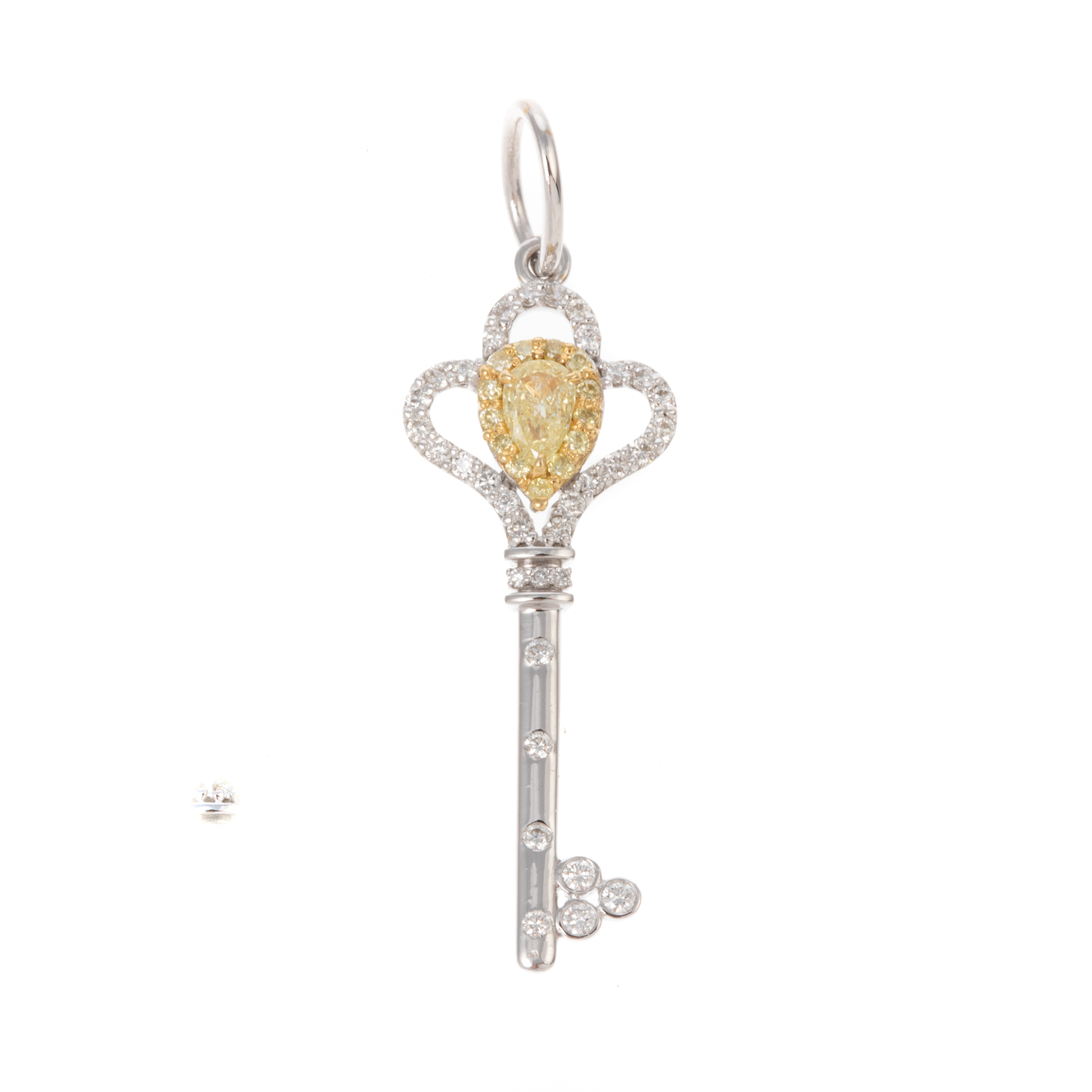 Appraisal: A YELLOW WHITE DIAMOND KEY PENDANT IN K K white