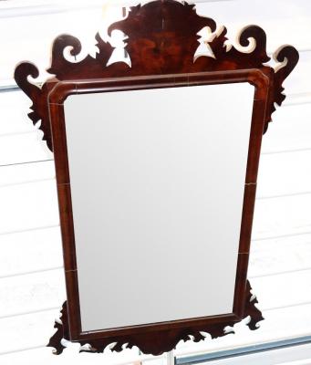 Appraisal: An th Century mahogany wall mirror with fret frame the