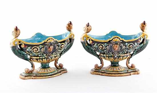 Appraisal: Pair majolica figural centerbowls richly molded and painted oval bowl