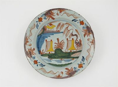 Appraisal: A large delftware polychrome dish painted in red blue green