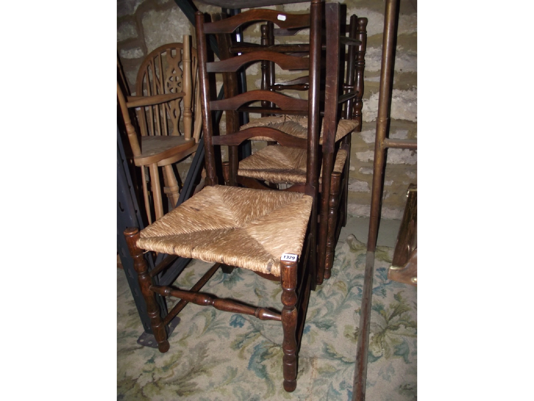 Appraisal: Miscellaneous chairs including three ladderback chairs with rush seats oak