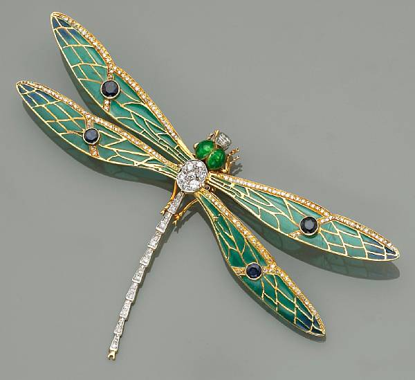 Appraisal: An enamel diamond sapphire and eighteen karat gold dragonfly brooch