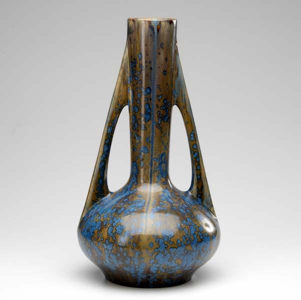 Appraisal: PIERREFONDS Tall and unusual vase with buttressed handles covered in