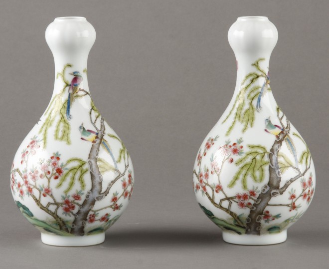 Appraisal: Vases feature birds and tree and floral motif on white