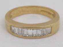 Appraisal: A baguette diamond ring channel set with diamonds each approx