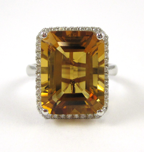 Appraisal: CITRINE DIAMOND AND FOURTEEN KARAT GOLD RING The white gold