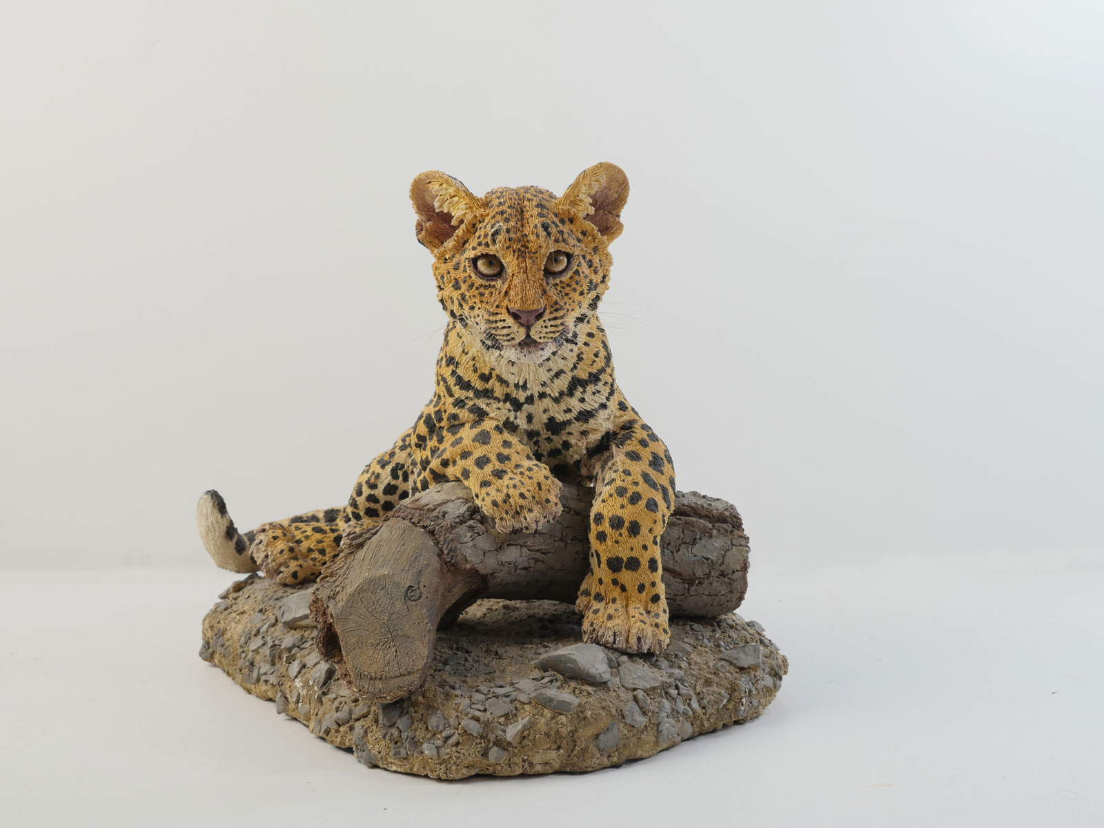 Appraisal: JOHANNA DRUMMOND LEOPARD CLAY SCULPTURE Individually carved clay sculpture of