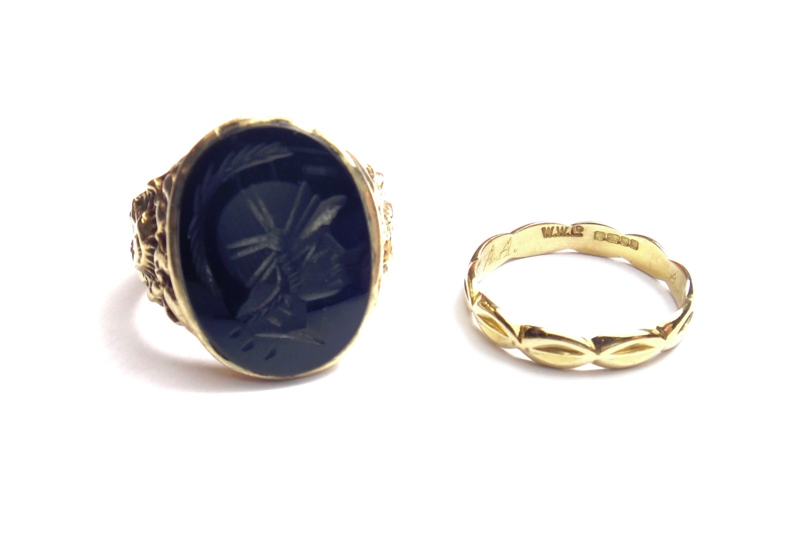 Appraisal: A gold and black onyx set intaglio ring carved as