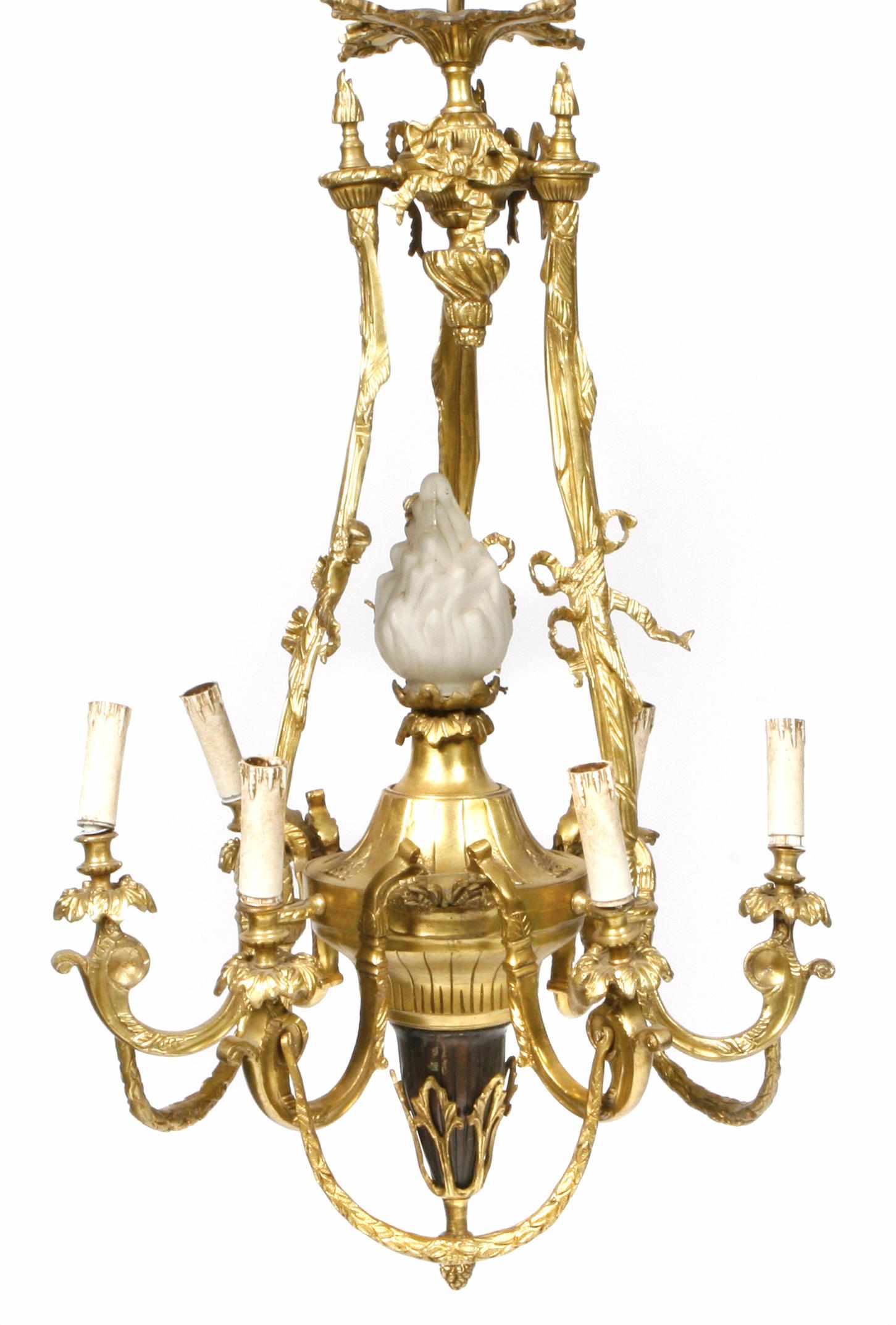 Appraisal: A Louis XVI style gilt and patinated bronze seven light