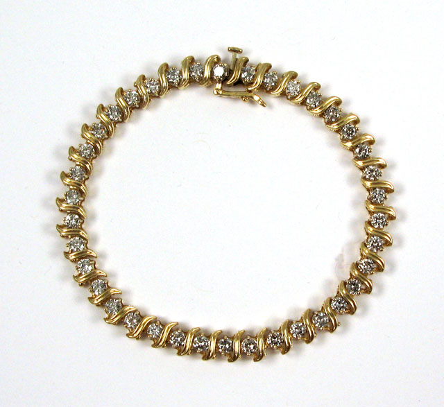 Appraisal: DIAMOND AND FOURTEEN KARAT GOLD BRACELET - in length and