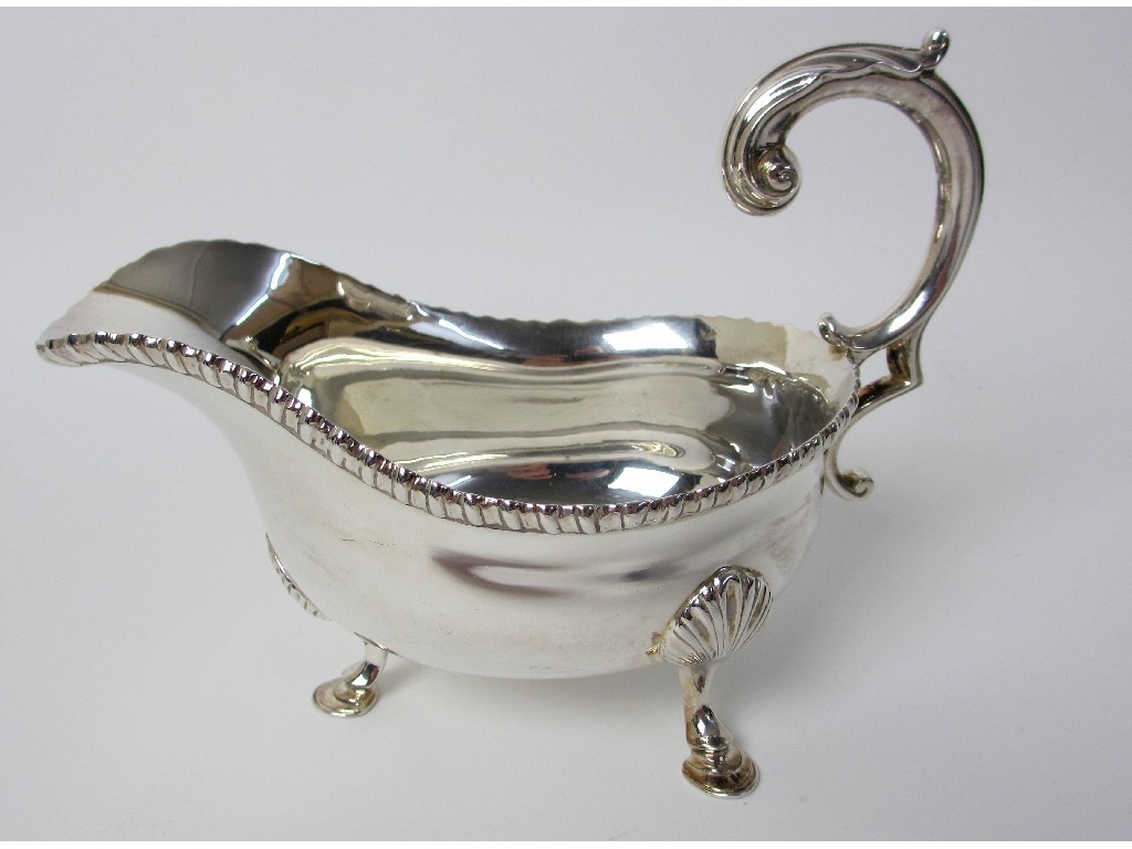 Appraisal: A silver sauceboat by Walter Charles Sissons of classic shape