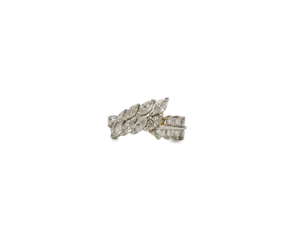 Appraisal: Platinum and Diamond Ring prong-set with nine marquise-cut diamonds and