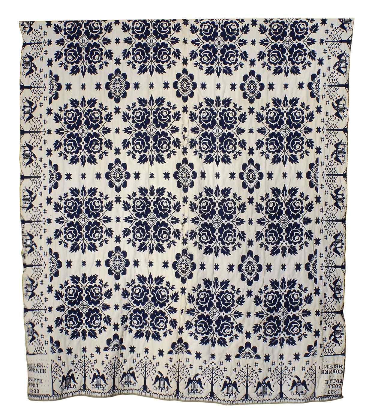 Appraisal: BLUE AND WHITE JACQUARD COVERLET th CenturyWith floral decoration and