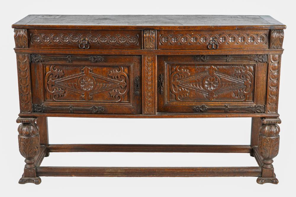 Appraisal: RENAISSANCE REVIVAL CARVED OAK SIDEBOARDwith two drawers over two hinged