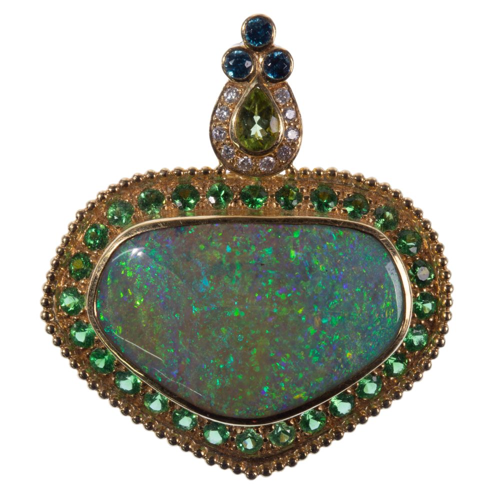 Appraisal: PAULA CREVOSHAY K YELLOW GOLD AND GEMSTONE PENDANT BROOCHAdorned with