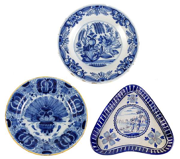 Appraisal: A pair of Dutch Delft circular plates and a triform